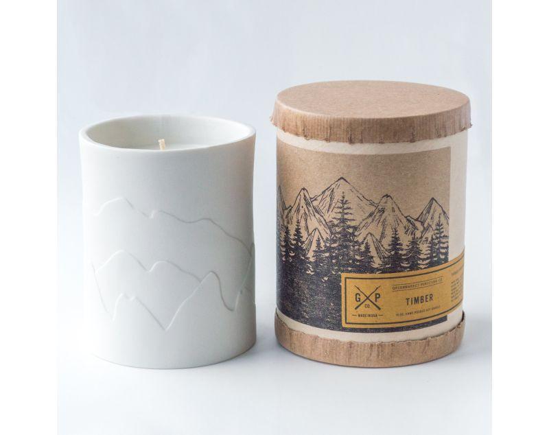 White porcelain candle with mountains that glow while the candle burns. Fragrances inspired by the outdoors.