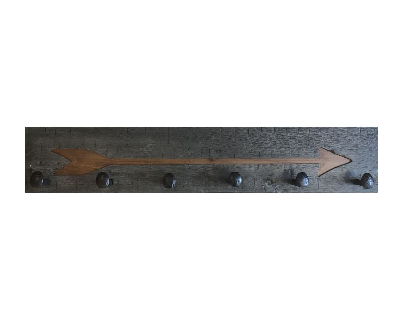 Wood wall coat rack with arrow burned into the wood. Reclaimed wood and railroad spikes as hooks.