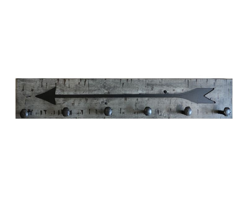 Wood wall coat rack with arrow burned into the wood. Reclaimed wood and railroad spikes as hooks.